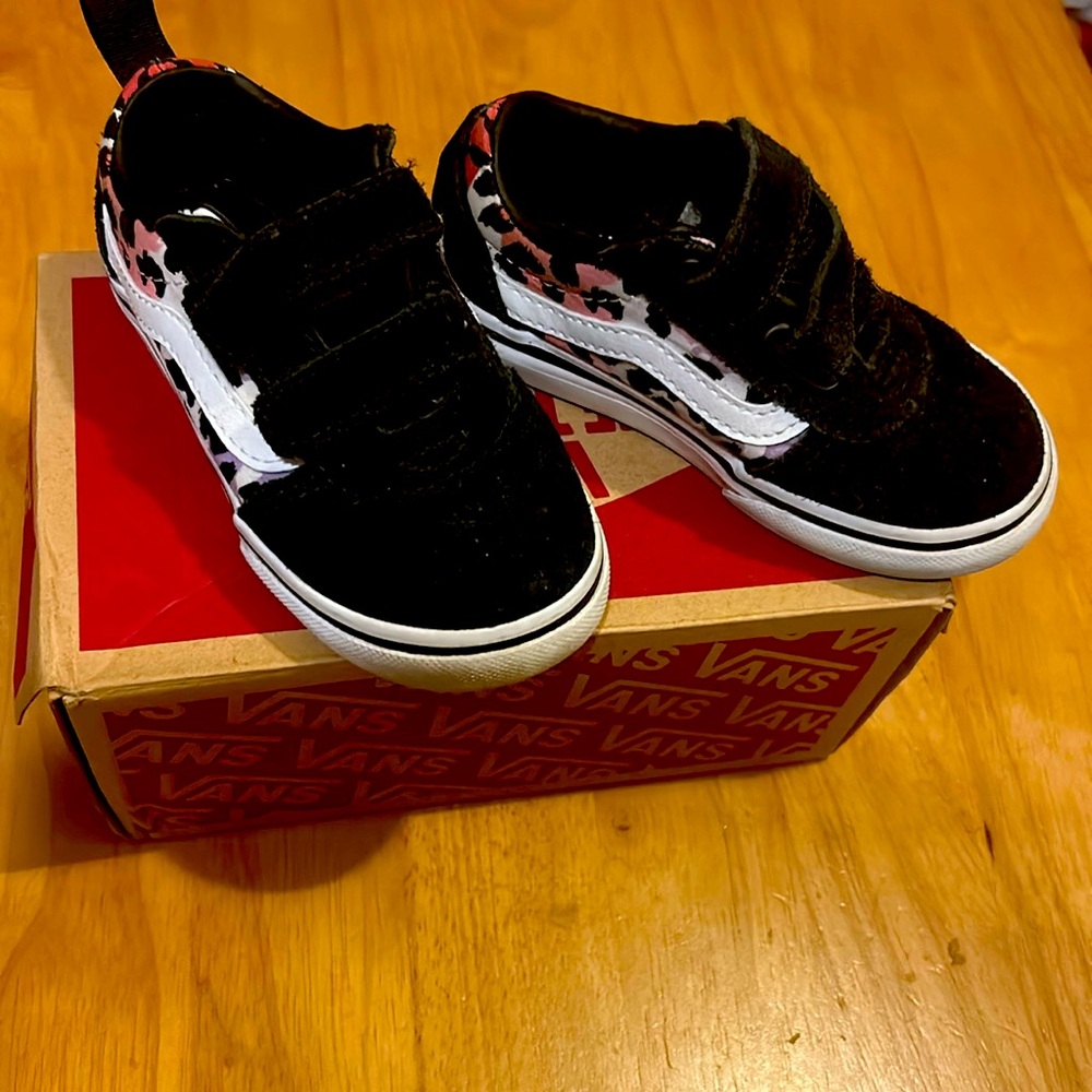 Black toddler Vans sneakers.